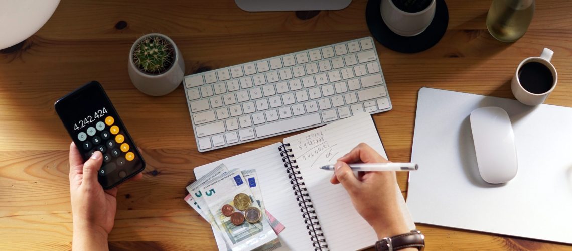 A closeup shot of an entrepreneur working from home on his personal finances and savings