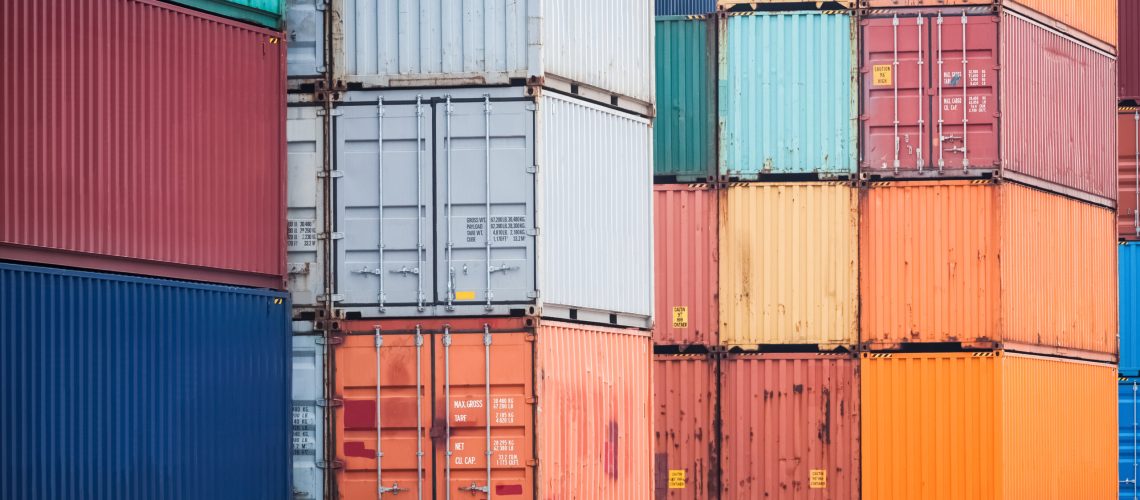 colorful container stacking in depot, modern logistics background